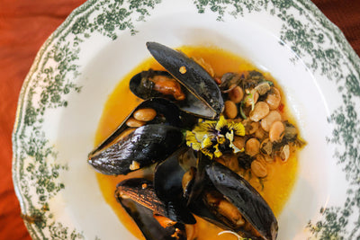 Steamed Mussels with Lupini Beans in Garlic Achaar Wine Sauce