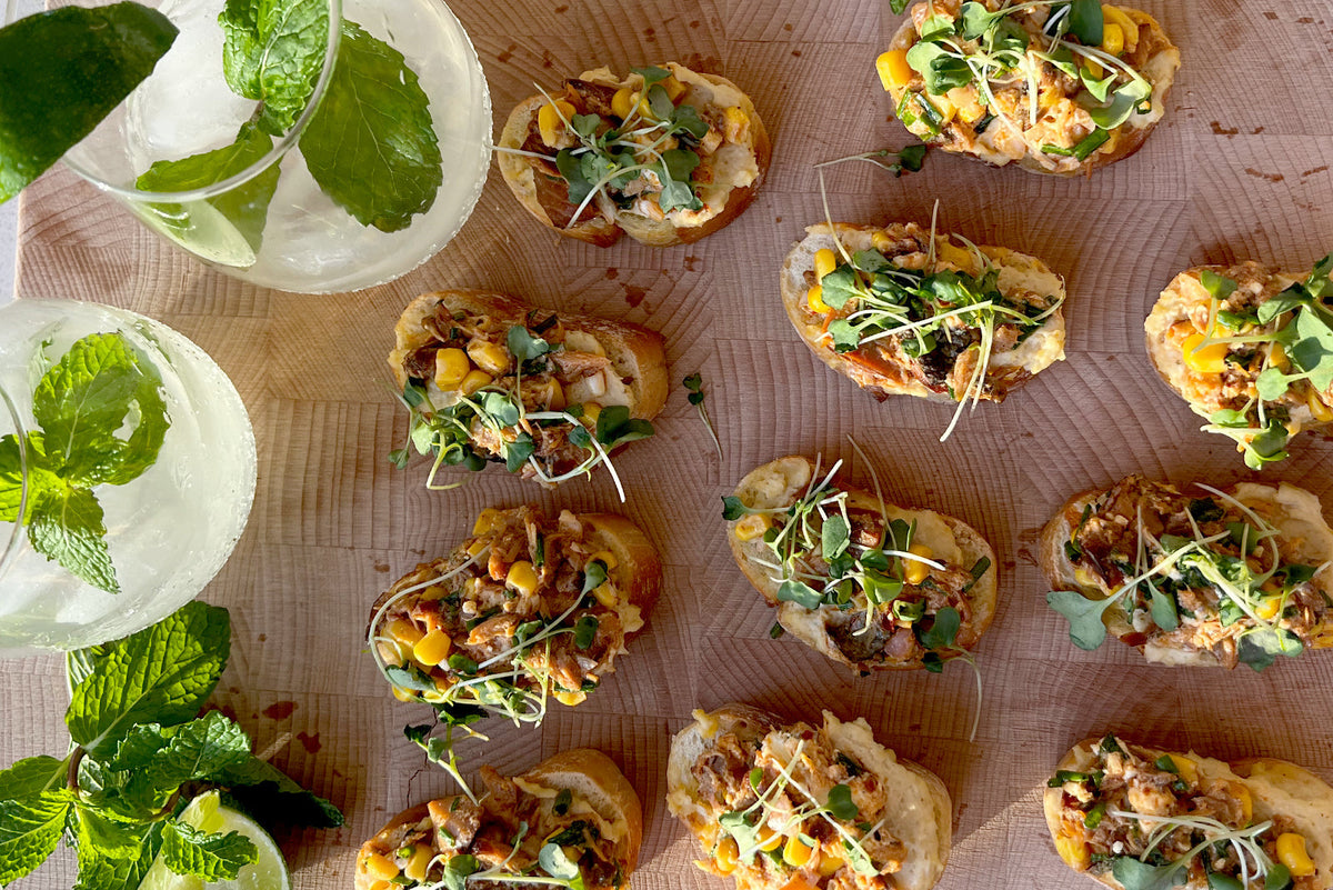 Smoked Fish & Hummus Crostinis with a Garden Party Cocktail